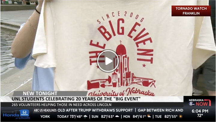 White shirt displaying "The Big Event" design with University of Nebraska text and campus illustration.