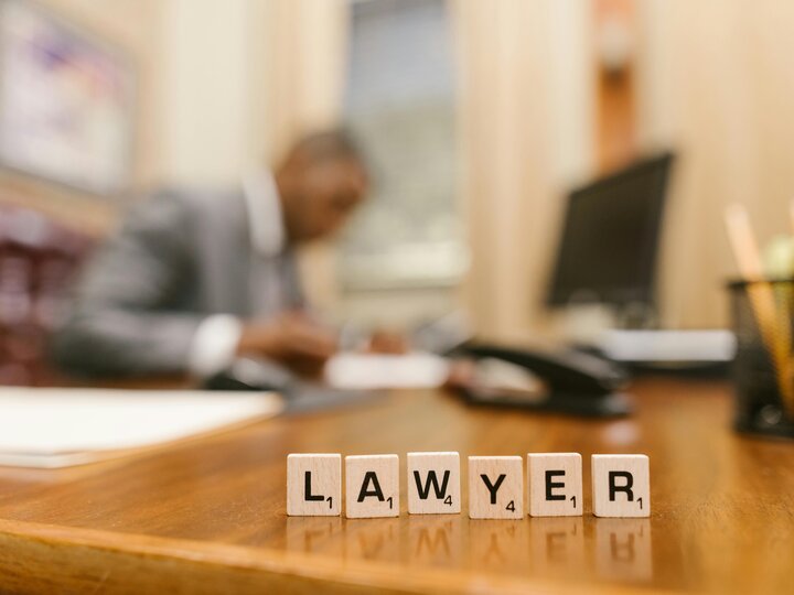 wooden letter tiles spelling the word Lawyer