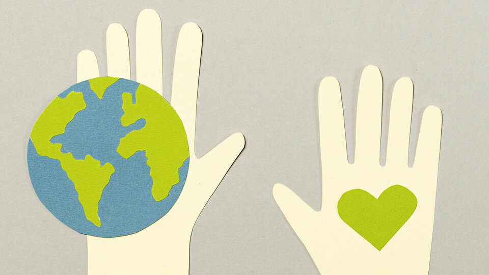 Artwork collage of a hand holding Earth and another hand holding a heart.